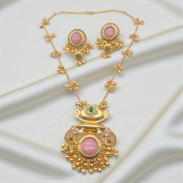 Pink Monalisa Stone Peacock Pendant Set in brass with matching earrings, pearl detailing and translucent pink Monalisa stone