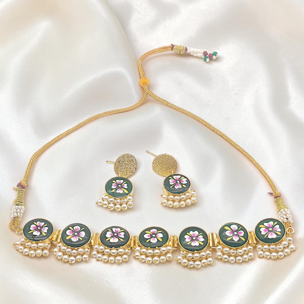 Dark Green Hand-Painted Brass Choker Set featuring Tanjore-inspired floral artwork, pearl accents, gold-tone brass finish and matching stud earrings