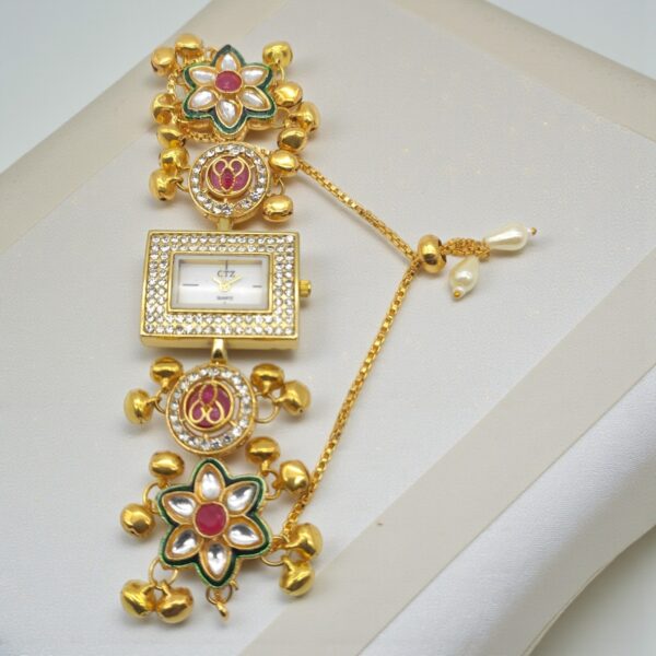 Floral Kundan Ghungroo Bracelet Watch with rectangular dial, floral kundan motifs, white stones, ghungroo accents and adjustable sliding chain closure.