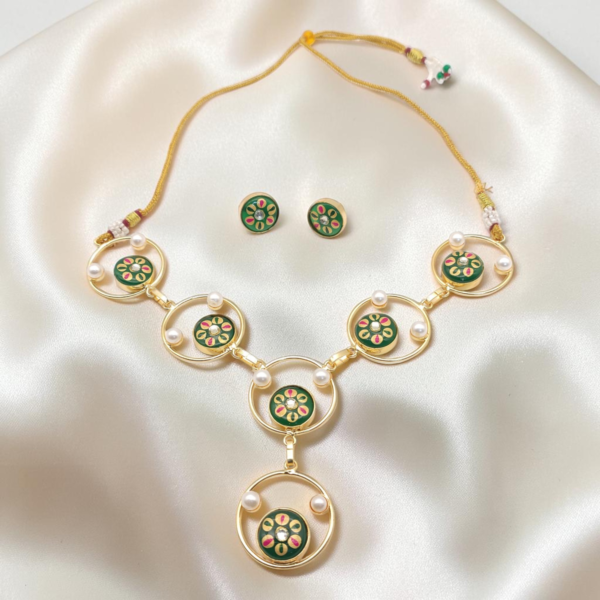 Green Hand-Painted Monalisa Stone Necklace Set in gold-tone brass with Tanjore-inspired motifs, Monalisa stones, pearl accents and matching stud earrings.