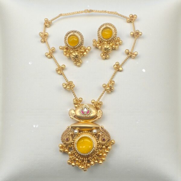 Yellow Monalisa Stone Peacock Pendant Set in brass with matching earrings, pearl detailing and translucent yellow Monalisa stone