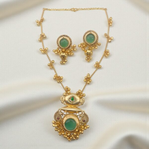 Mint Green Monalisa Stone Peacock Pendant Set in brass with translucent mint green Monalisa stone and matching earrings