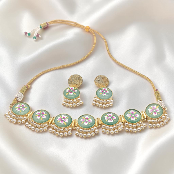 Mint Green Hand-Painted Brass Choker Set featuring Tanjore-inspired floral artwork, pearl accents, gold-tone brass finish and matching stud earrings.
