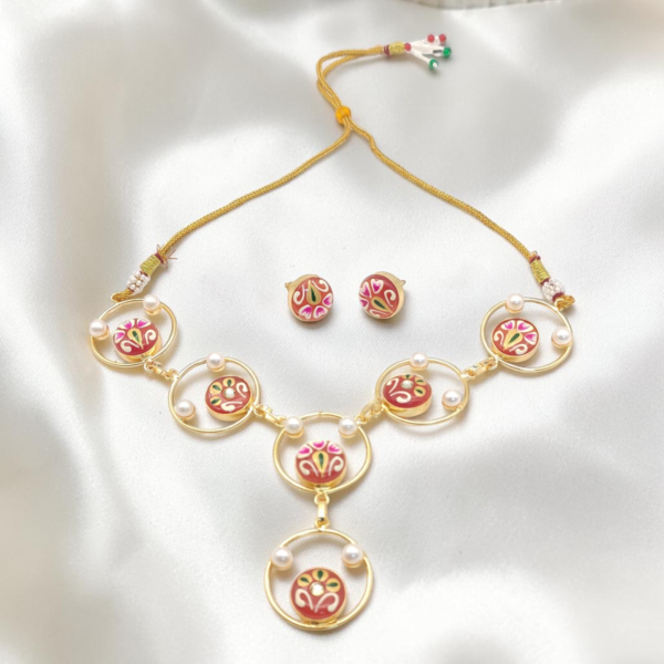 Pink Hand-Painted Monalisa Stone Necklace Set in gold-tone brass with Tanjore-inspired motifs, Monalisa stones, pearl accents and matching stud earrings